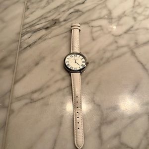 Anne Klein watch - w/white leather strap. Round dial Roman numerals.  2nd hand